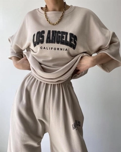Detailed knit texture and Los Angeles print on casual two-piece beige leisure set