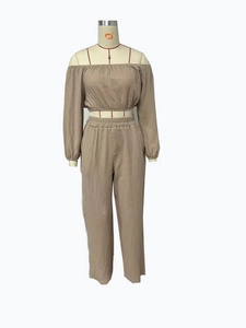 Close-up of the pleated texture fabric and elastic waistband on khaki two-piece set