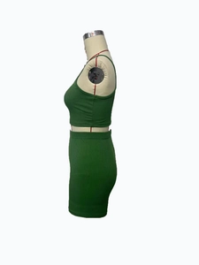 Detail view of green ribbed knit two-piece set featuring camisole and bodycon skirt