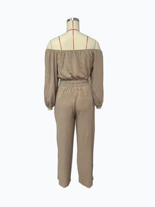 Detail view of khaki cotton twinset featuring elastic waistband and textured fabric
