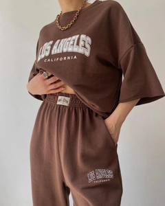 Close-up of Los Angeles letter print and brand label on brown cotton lounge set