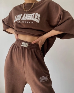 Detail of Los Angeles print on brown vintage tracksuit with drawstring sweatpants