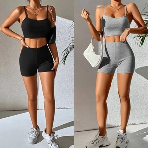 Macro detail of ribbed knit texture on two-piece yoga crop top and cycling shorts set