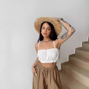 Women's ruffle hem white crop top and brown wide-leg trousers vacation set