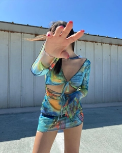 Detail of blue butterfly print mesh mini dress with deep V-neck and flared sleeves