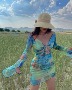 Detail of Y2K long sleeve dress with colorful abstract print and lace-up cutout front