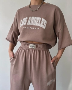 Detail of Los Angeles print on a pink short sleeve sweatshirt and joggers set