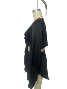 Detail view of black satin long sleeve top and elastic waist shorts matching set