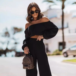 Women's black off-shoulder long sleeve crop top and high-waist wide-leg pants set