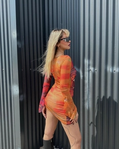 Detailed view of orange gradient print and mesh texture on long sleeve Y2K mini dress