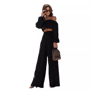 Women's black off-shoulder long sleeve crop top and high-waisted wide-leg trousers set