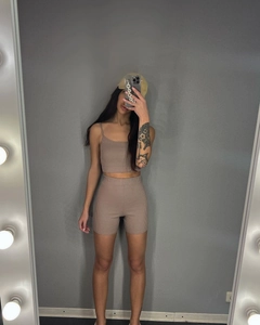 Mirror selfie showing a ribbed knit two-piece set with crop camisole and biker shorts