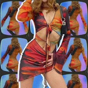 Detail of Y2K bodycon dress featuring abstract fire print and waist cut-out accents