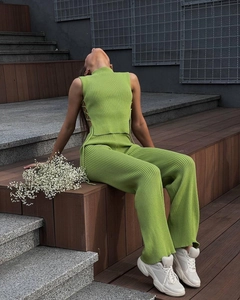 Detail showing the lace-up side design and ribbed knit texture of this green two-piece set