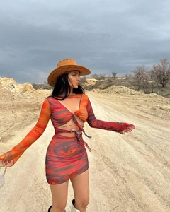 Detail of multi-color tie-dye mesh two-piece set with V-neck top and mini skirt