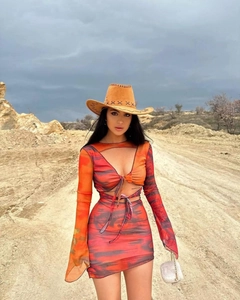 Close-up of Y2K tie-dye two-piece set with long sleeve cutout top and bodycon skirt