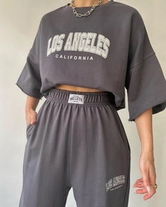 Detail of loose short sleeve tee and pleated pants set with Los Angeles print