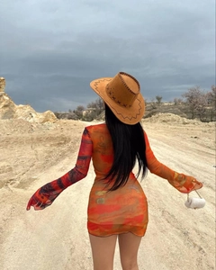 Rear view of bodycon long sleeve mesh dress featuring orange abstract flame print