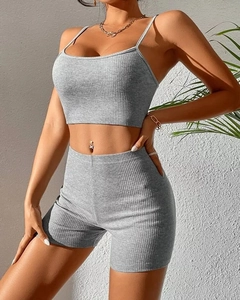Detail of grey ribbed knit yoga set showing fabric texture on crop top and shorts