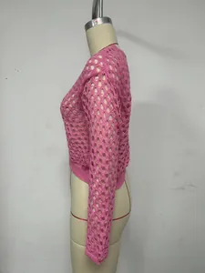 Side view of pink crochet crop top with hollow out knit pattern and flare sleeves