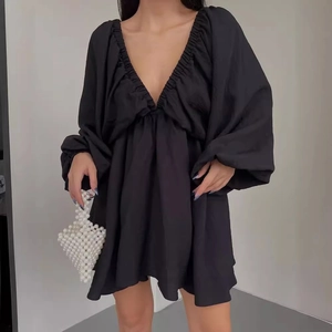 Elegant black V-neck long sleeve mini dress with puff sleeves and pleated detailing
