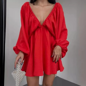 Elegant red V-neck mini dress with long puff sleeves and a flared skirt design