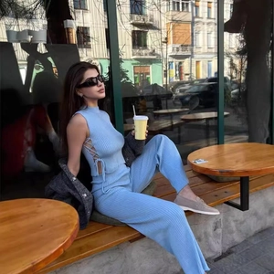 Sky blue knit two-piece set featuring sleeveless tie-side top and wide-leg trousers