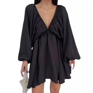 Elegant black V-neck maxi dress with lantern sleeves and textured flowing skirt