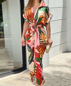 Detail view of tropical floral print shirt dress with lapel collar and waist belt tie