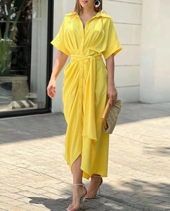 Full view of a yellow short-sleeve midi shirt dress with buttons and waist belt