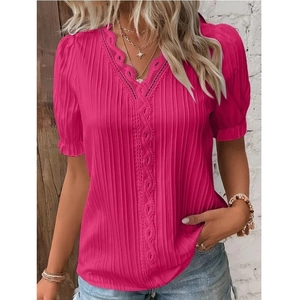 Detail of rose red summer shirt featuring V-neckline with lace crochet trim and pleats