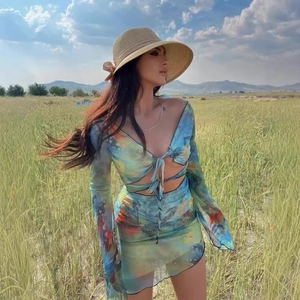 Two-piece printed mesh set with long sleeve tie-front crop top and bodycon skirt