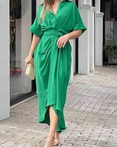 Detail of emerald green lapel shirt dress with waist tie and pleated texture fabric