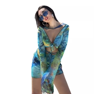 Mesh two-piece set featuring abstract tie-dye print with tie-front top and bodycon skirt