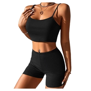 Women's black ribbed two-piece yoga set with crop top and high-waisted biker shorts