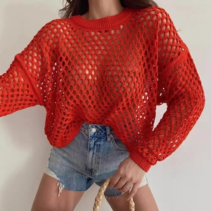 Women's red open-knit crochet sweater with flared sleeves and loose fit style