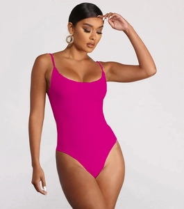 Detail of fuchsia ribbed one-piece swimsuit with spaghetti straps and high-cut leg design