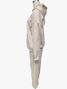 Detail view of the apricot fleece-lined hoodie and matching joggers set on a mannequin