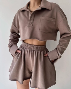 Detailed view of dusty pink lounge set featuring raw edge hems and soft sweatshirt fabric