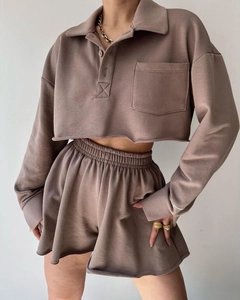 Close-up of brown long sleeve polo sweatshirt and high waist drawstring shorts set