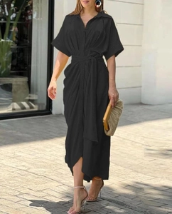 Detail of a black short-sleeved maxi shirt dress with lapel collar and adjustable waist tie