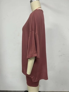 Detail view of mauve loungewear set featuring an oversized T-shirt and slim-fit shorts