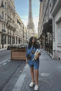 Navy blue casual T-shirt and cycling shorts set worn in front of the Eiffel Tower