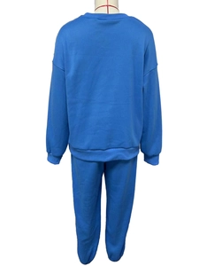 Back view of a blue fleece two-piece sweatsuit with ribbed cuffs and hem on mannequin