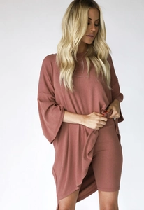 Detail showing the vertical ribbed knit texture and drape of this rose pink lounge set