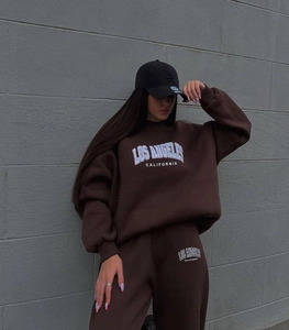 Close-up of brown oversized tracksuit with Los Angeles California graphic print