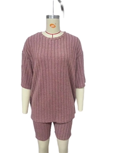 Detail showing the vertical ribbed knit texture and dusty rose fabric of the lounge set