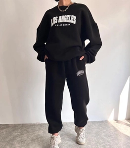 Detailed close-up of Los Angeles print on a black fleece hoodie and jogger set