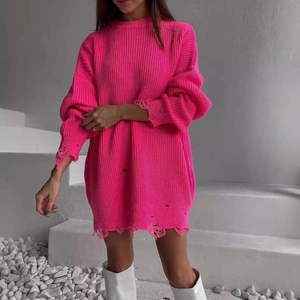 Oversized neon pink distressed knit sweater dress with ripped hem and loose fit for women