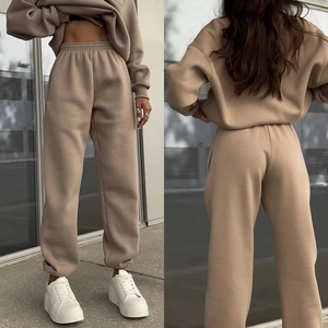 Detail view of khaki fleece tracksuit featuring thick hoodie and high-waist joggers set